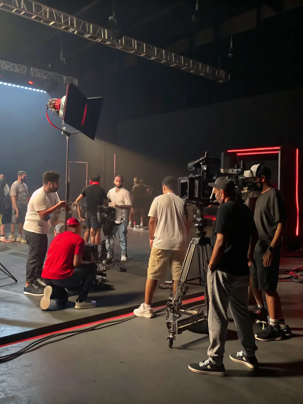 A photo of participants in a theatre workshop organized by ULAL DTO, showing them actively engaged in a scene rehearsal.